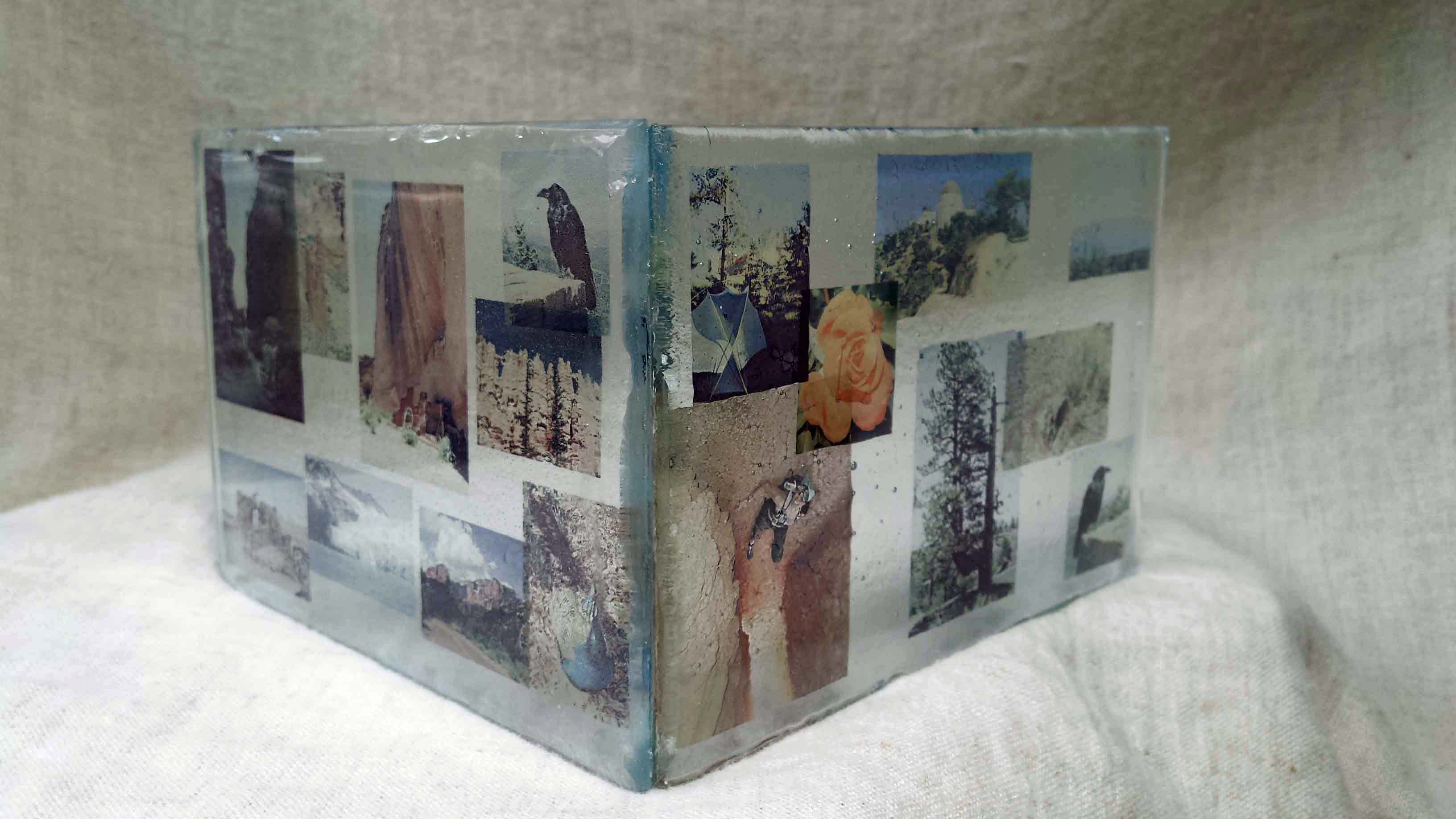 Transparent enamel photos embedded in layers of glass